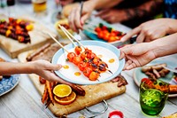 Closeup of hands with homemade gill at a summer party