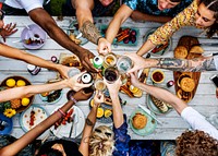 Aerial view of a diverse group of friends toasting together