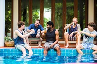 Group of diverse men sitting by the pool