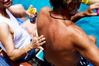 Closeup of senior adult sitting by the pool together