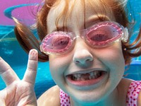 Closeup of caucasian girl underwater in the pool