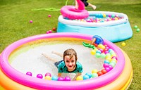 Kid playing in a rubber pool