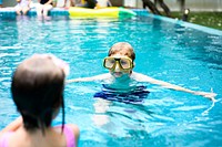 Kids with goggles playing in a pool
