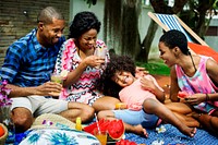 Black family enjoying summer together at backyard