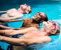 Group of diverse senior men enjoying the pool together