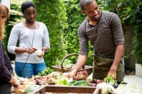 African descent man with various fresh organic vegetable