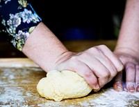 Close up of hands kneading dough for pastry