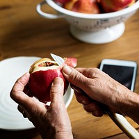 Hand peeling apple