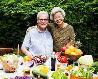 Senior couple with fresh vegetable outdoors