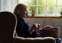 Closeup of senior caucasian woman knitting handicraft hobby