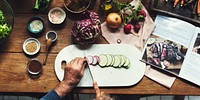 Hands using knife chopping a zucchini