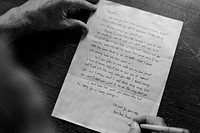 Closeup of senior man writing letter