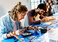 Electrical technicians working on computer parts