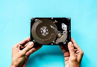 Hands holding HDD isolated on background