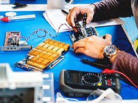 Technicians working on electronics parts