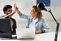 Computer technicians friends hits their palms together