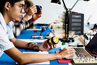 Technician working on robot programming