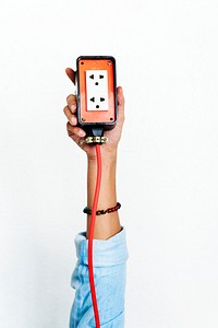 Hand holding electric outlet isolated on background