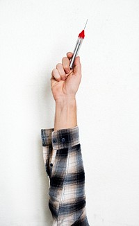 Hand holding equipment tool isolated on background