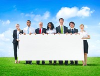 Cheerful Business People Holding Empty Billboard Outdoors