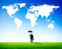 Businessman with umbrella world map