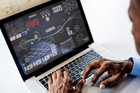 African ethnicity man working with infographic on laptop