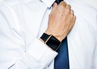 Hand with smartwatch adjust necktie