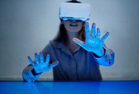 Woman experiencing metaverse, wearing virtual reality headset