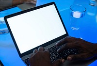 Hands using laptop on a cyber space table