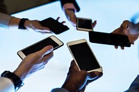 Group of hands holding using smartphone