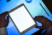 Hands holding using tablet on a cyber space table