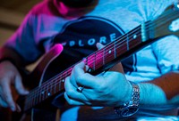 Man playing guitar in an event