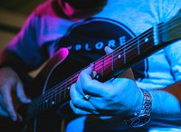 Man playing guitar in an event