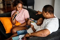 Black family enjoy singing karaoke