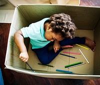 Black kid enjoying his painting