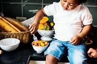 Black kid in the kitchen