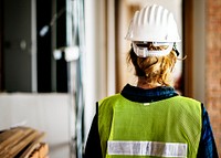Woman constructor wearing security clothing