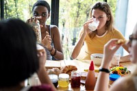 Group of diverse women having breakfast together