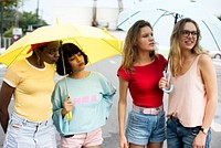 Group of diverse women with umbrella