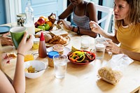 Group of diverse women having breakfast together