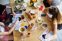 A group of diverse women having breakfast together