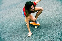 Closeup of a Caucasian woman skateboarding