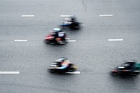 Aerial view of blurred motorbikes on the street in downtown