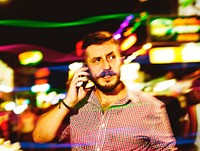 Man talking on the phone at street night market