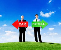 Two Businessmen Holding Contrasting Arrows for Car and Bicycle