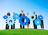Business People Outdoors Holding Gears Outdoors