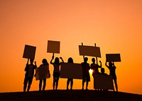 Silhouette of people protesting