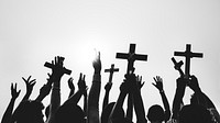Silhouette of Christians holding crosses