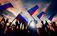 Silhouettes of People Holding Flag of Russia