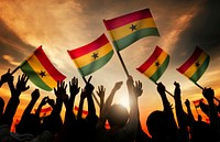 Silhouettes of People Holding Flag of Ghana